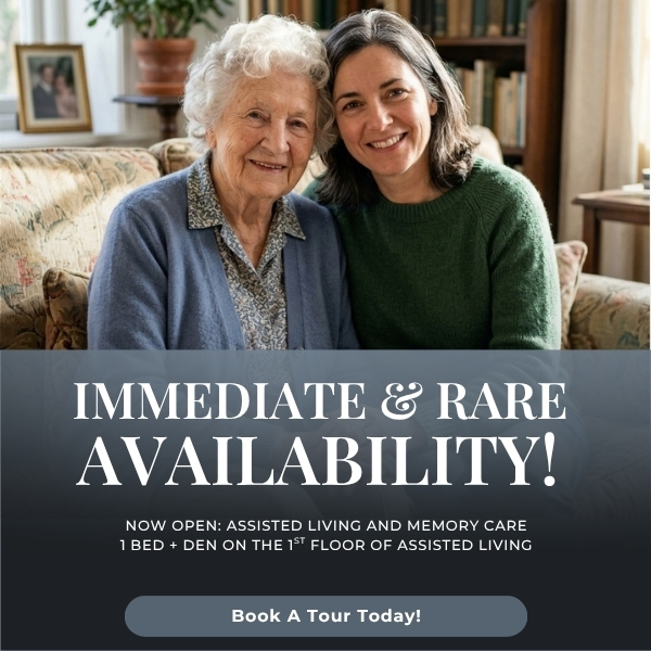 Two smiling women sit together on a sofa in a home setting; banner text promotes immediate availability for assisted living services.